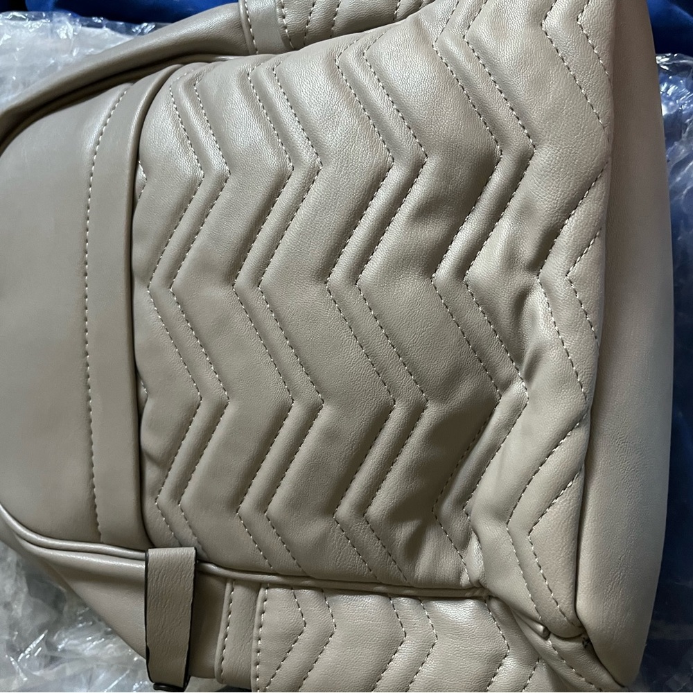 Brand New with tags grey leather back pack with tags